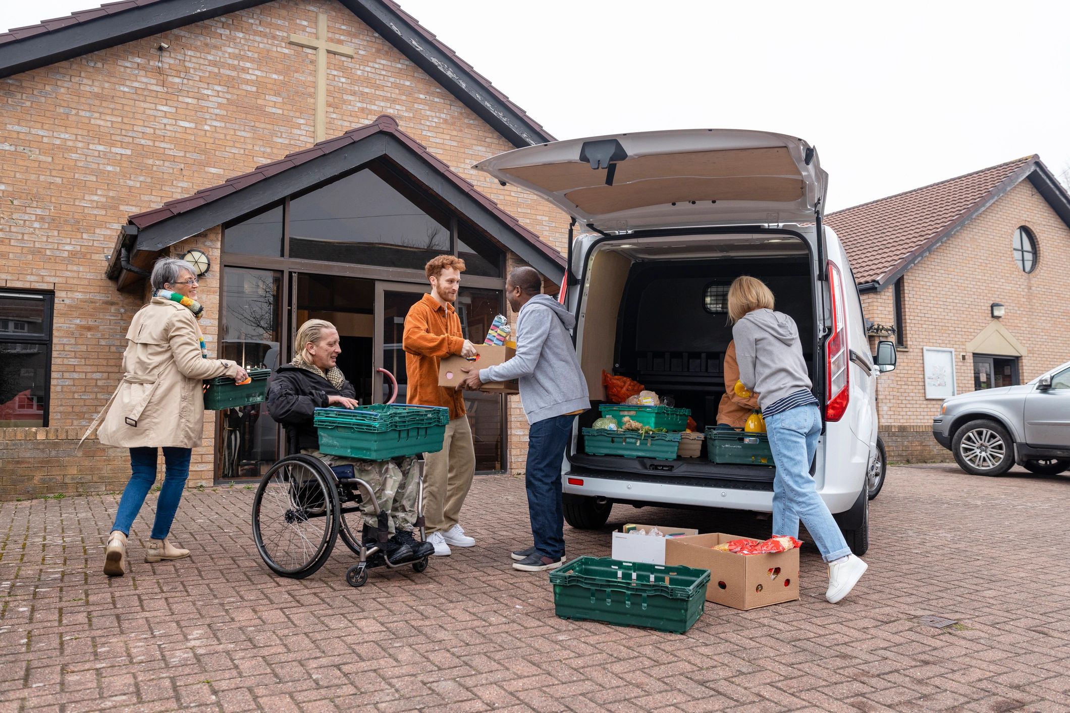 Volunteers unloading food support for community relief