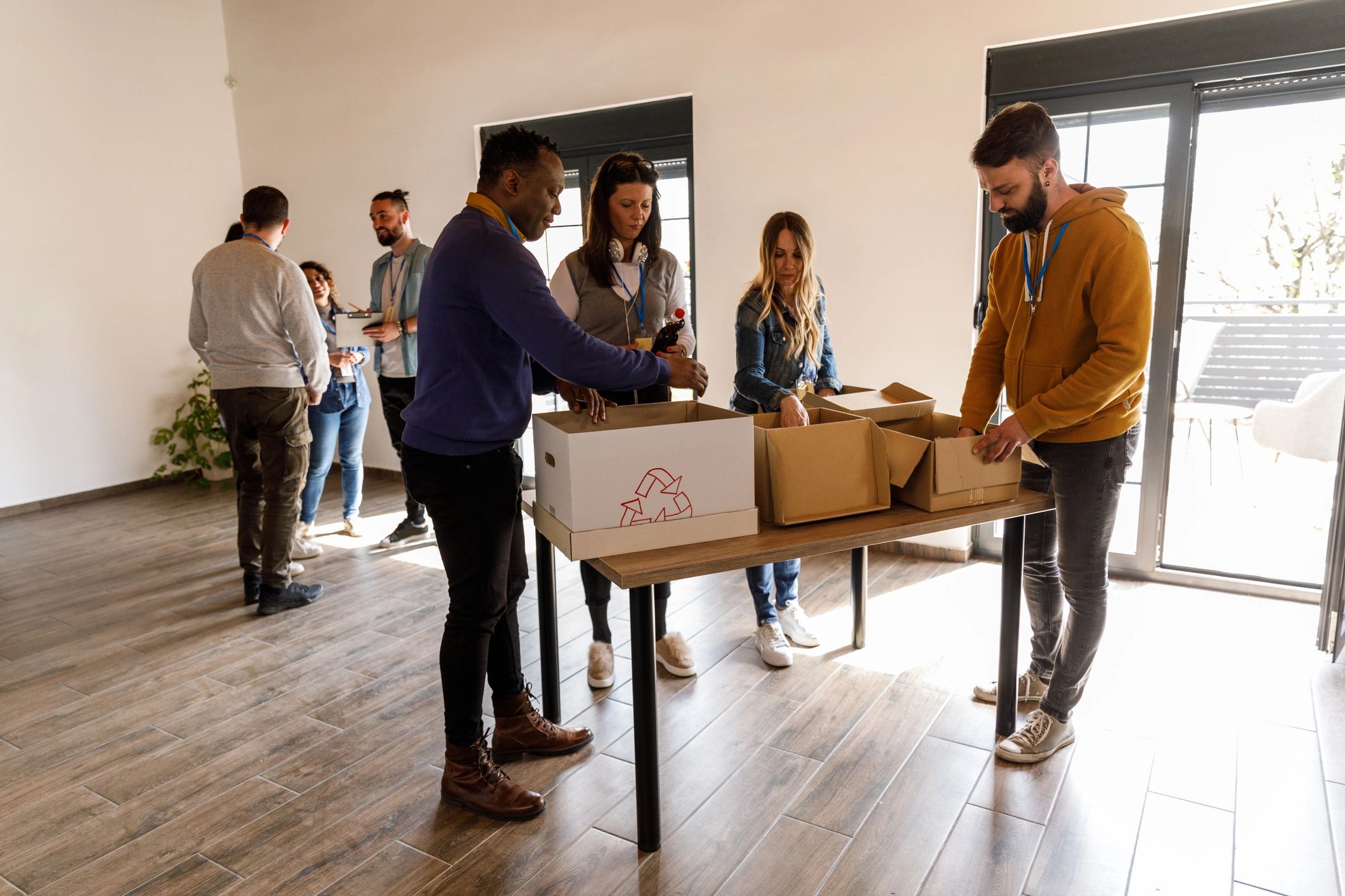 Team members sorting donation boxes at a nonprofit center