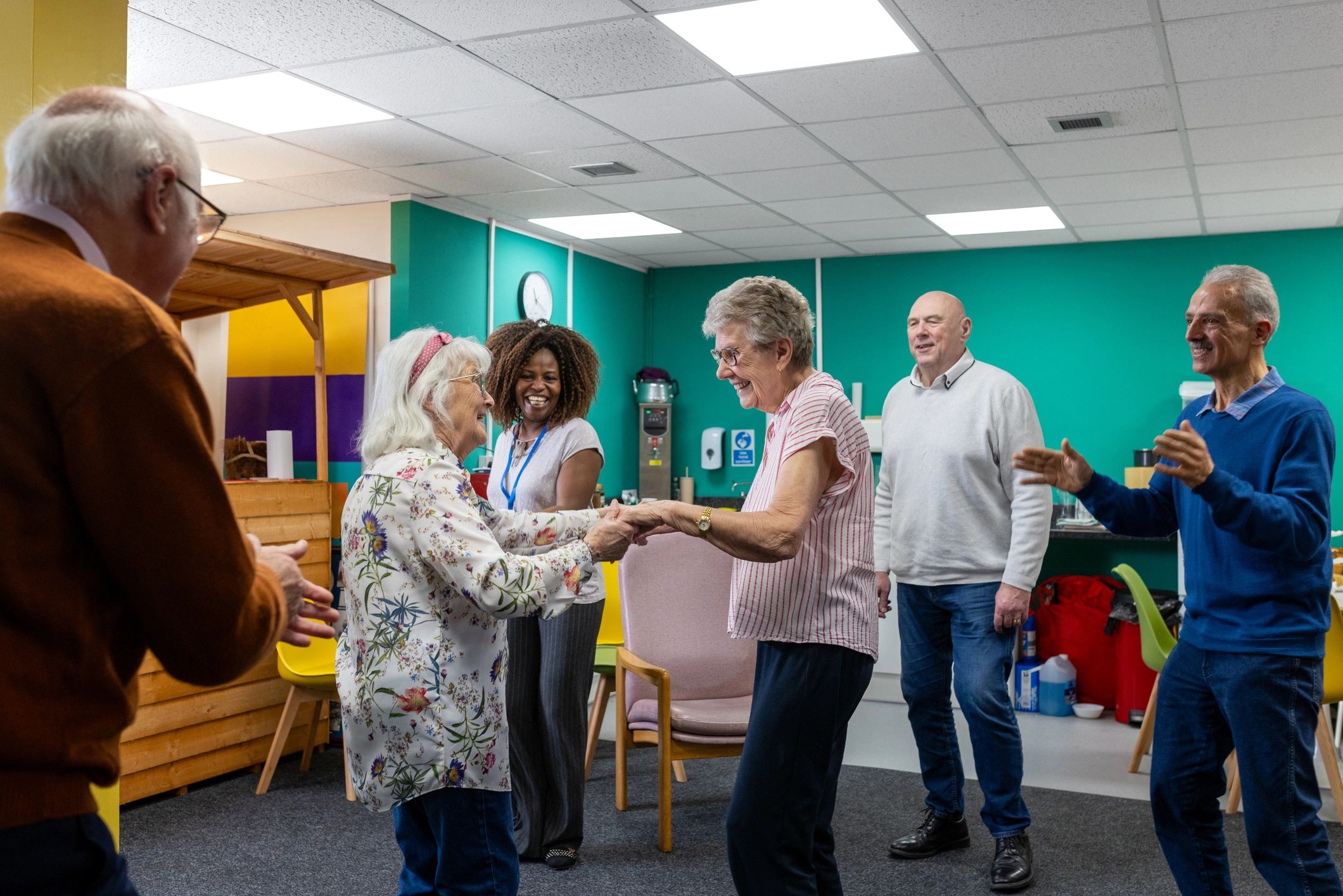 Community members participating in a supported social program